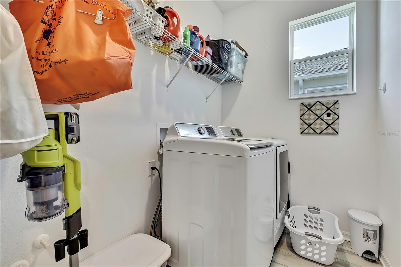 inside laundry room with a window - 9764 SW 100TH AVENUE RD, OCALA