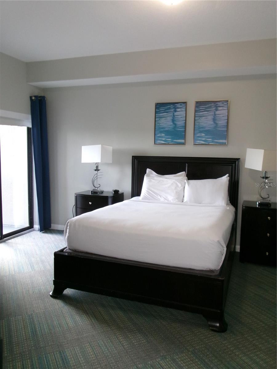 One bedroom has sliding door access to the balcony - 14501 GROVE RESORT AVE #1612, WINTER GARDEN