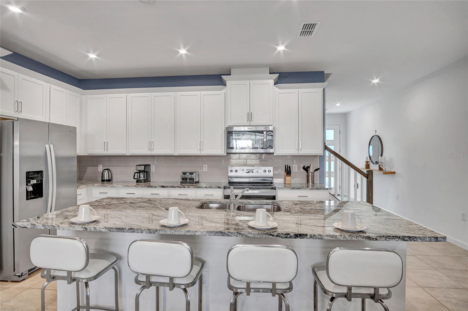 Large center island with seating - 2382 ZABALLINA PL, KISSIMMEE