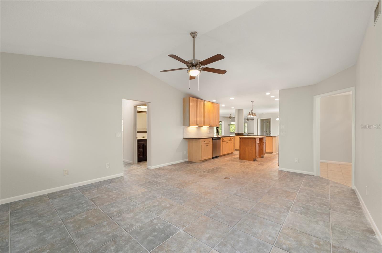 Family Room with the guest bedrooms to the left. - 17356 GULFSPRAY CIR, PORT CHARLOTTE
