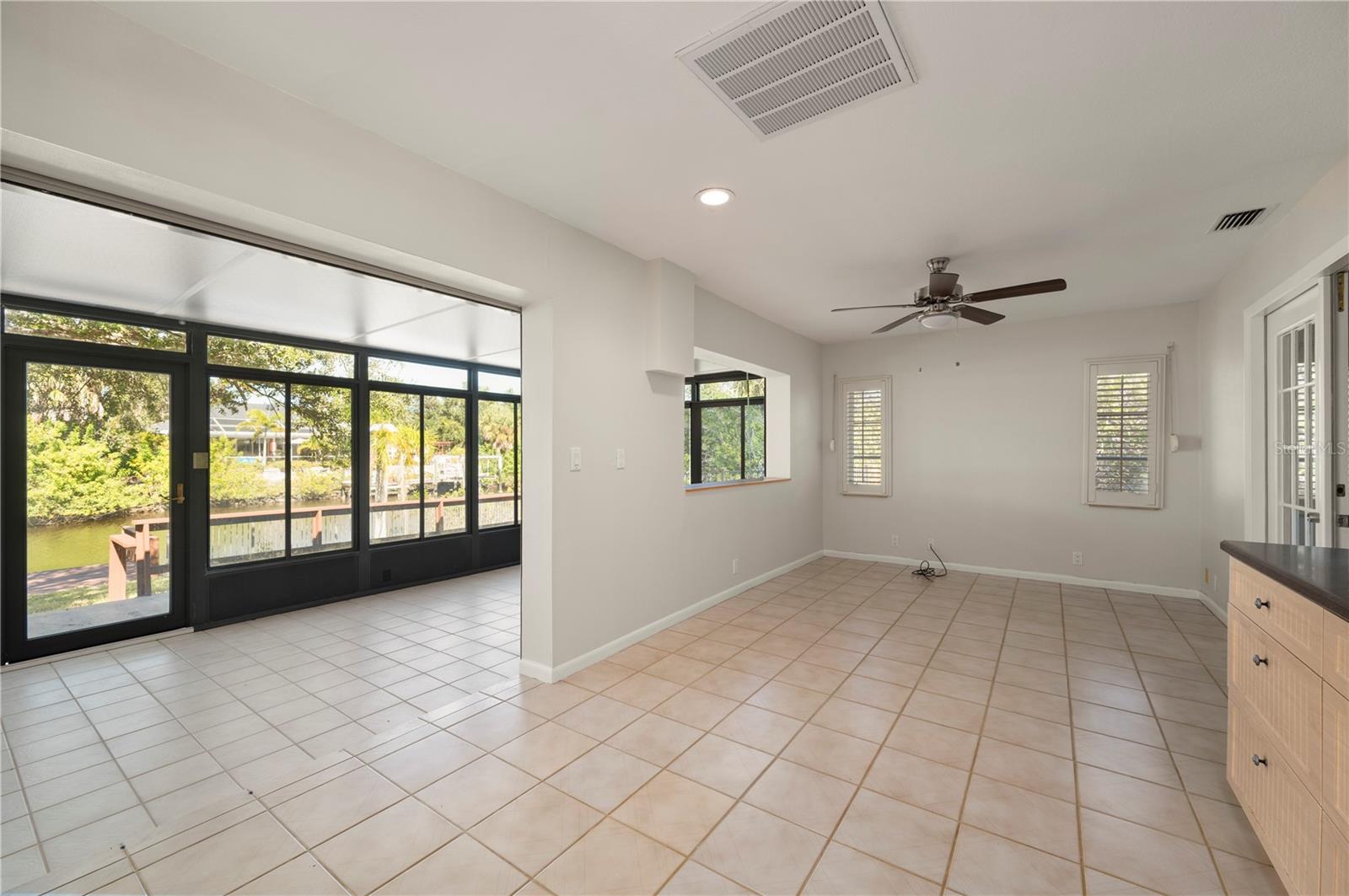 This is the spacious Bonus Room and leads to the Sun Room. - 17356 GULFSPRAY CIR, PORT CHARLOTTE