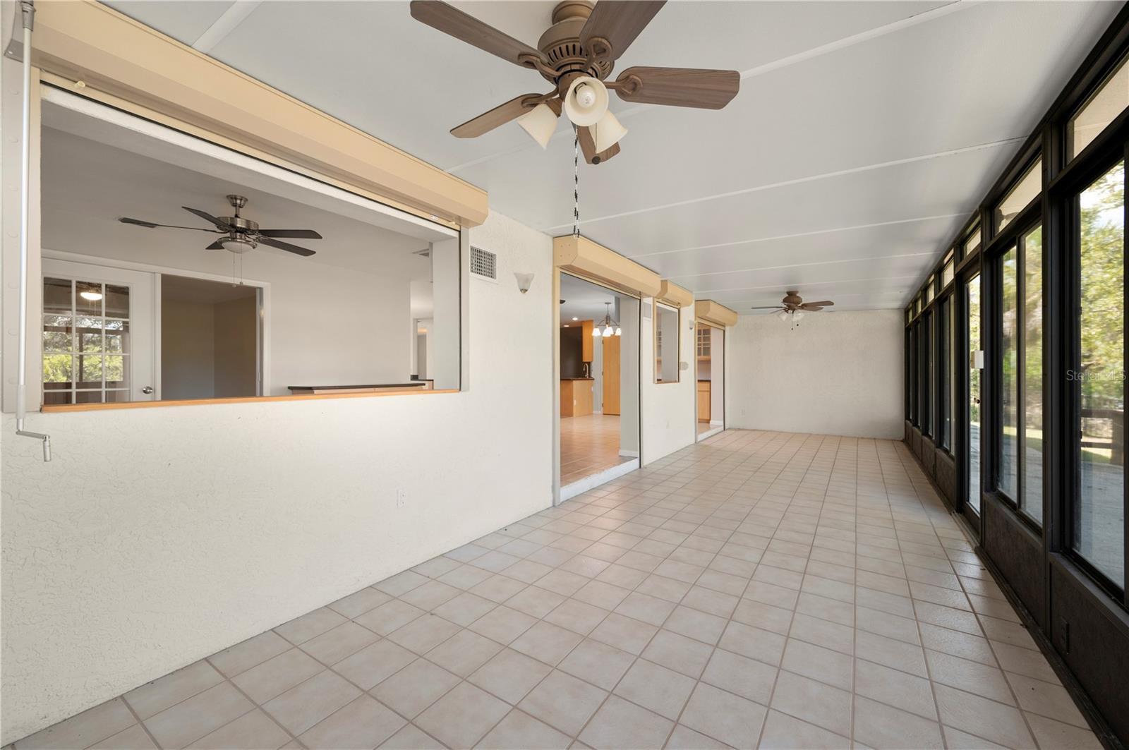 Sun Room (Florida Room) has hurricane shutters. - 17356 GULFSPRAY CIR, PORT CHARLOTTE