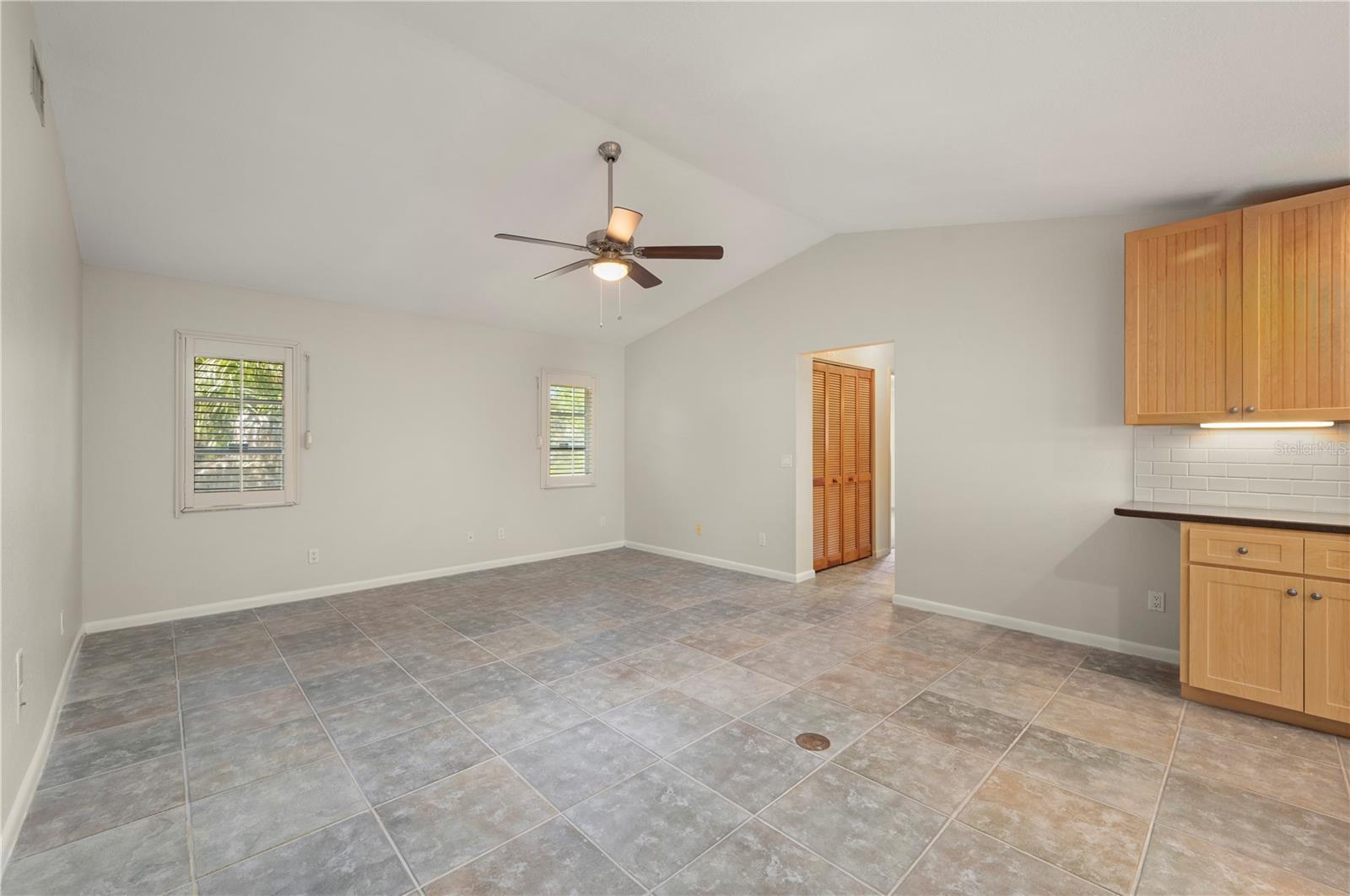 Family Room and entry to the guest bedroom suite - 17356 GULFSPRAY CIR, PORT CHARLOTTE