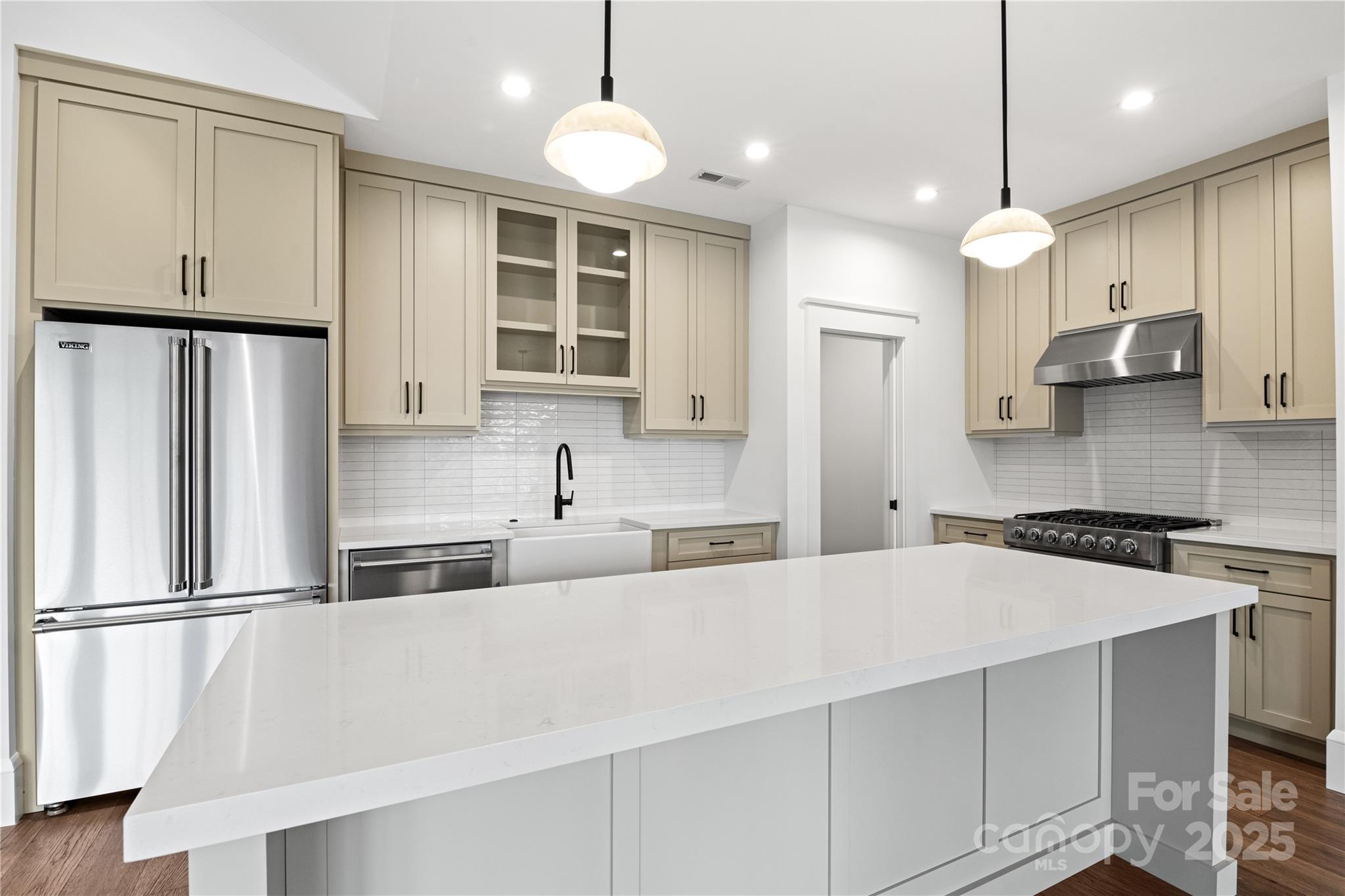 Kitchen with Viking Appliances & Quartz Counters - 127 Creekside Valley Lane, Arden