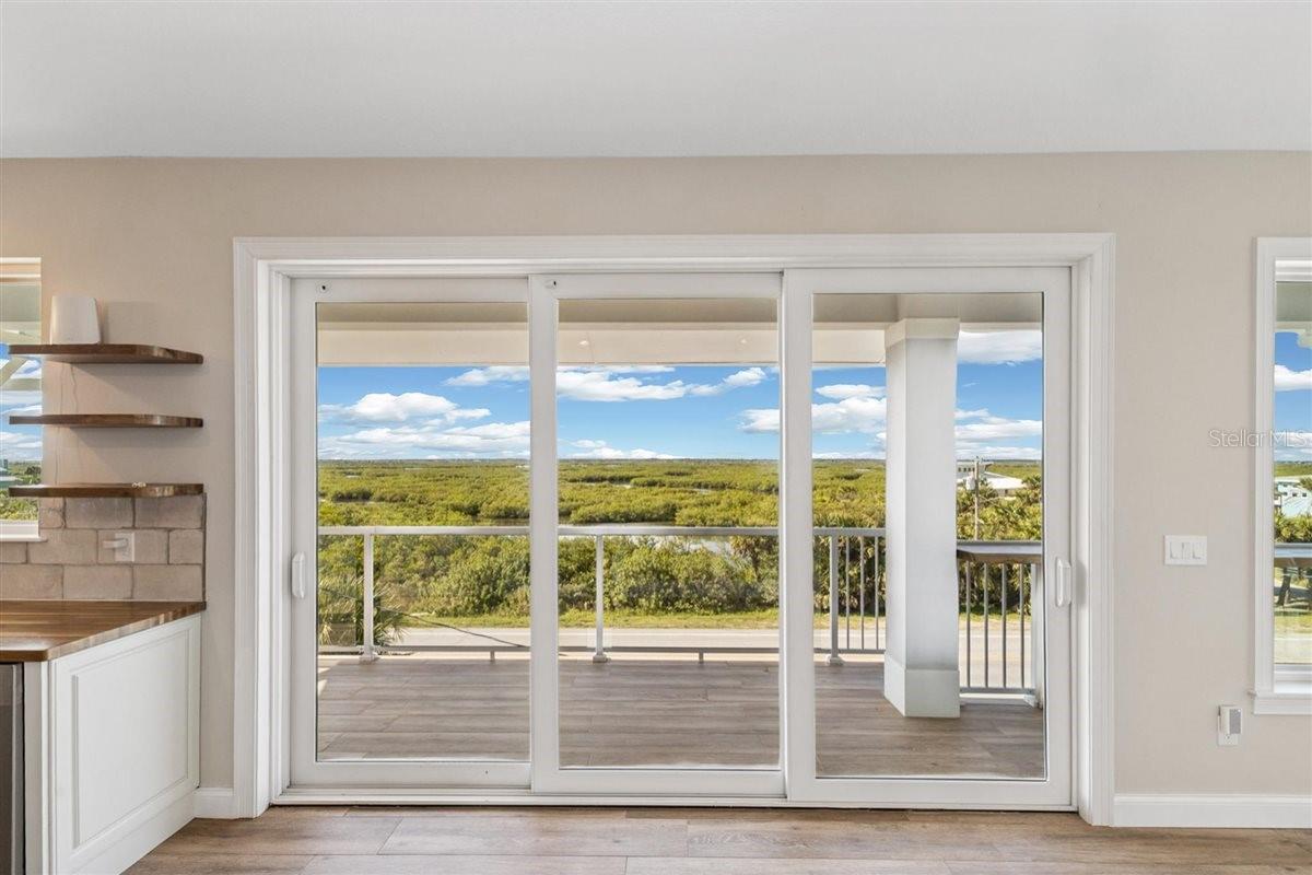 Glass sliders to back balcony - 6191 TURTLEMOUND RD, NEW SMYRNA BEACH