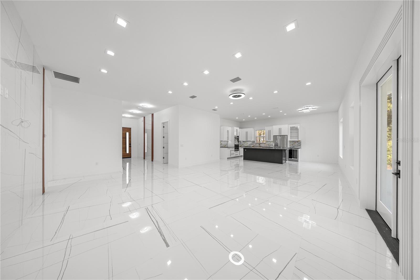 VIEW OF LIVING ROOM / DINING ROOM / ENTRANCE FOYER / KITCHEN - 6877 SW 131ST CIR, OCALA