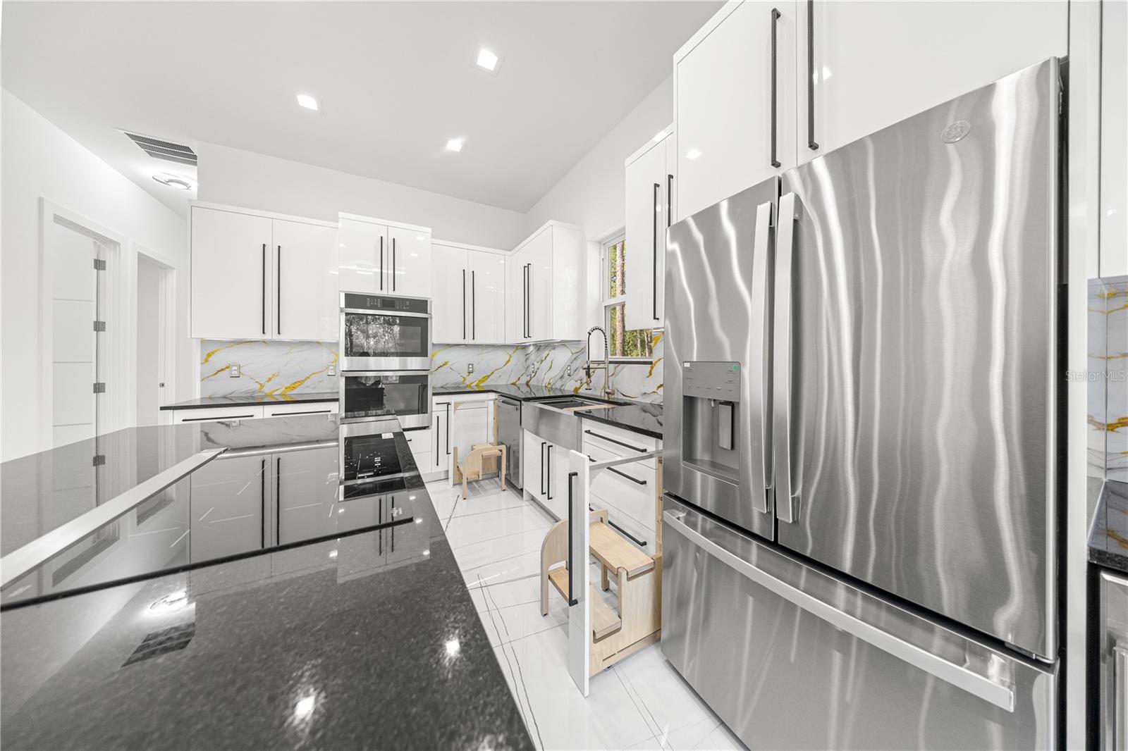 KITCHEN -VIEW OF HIDDEN STEPS AND ISLAND - 6877 SW 131ST CIR, OCALA
