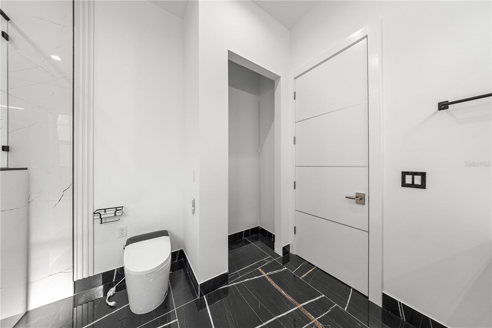 PRIMARY BATHROOM - BIDET/TOILET COMBO AND LINEN CLOSET - 6877 SW 131ST CIR, OCALA