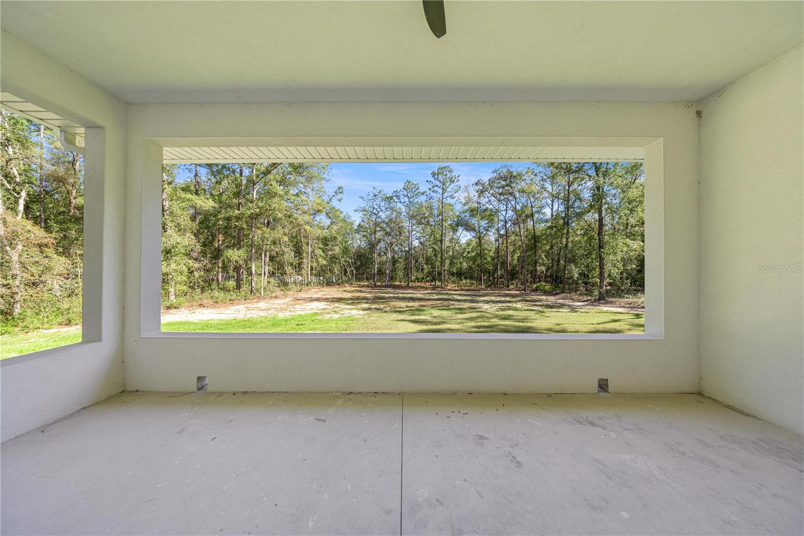 VIEW OF THE BAKYARD FROM THE PATIO - 6877 SW 131ST CIR, OCALA