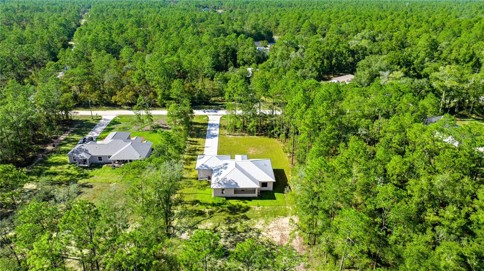 AERIAL VIEW OF THE COMPLETE PROPERTY FROM THE BACK AND NEIGHBORHOOD - 6877 SW 131ST CIR, OCALA
