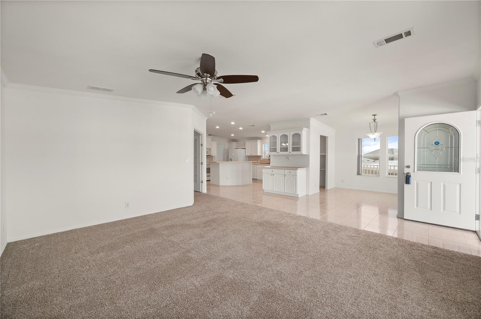 Open Concept has the Living Room open to Dining Room and Kitchen - 67 WINDMILL BLVD, PUNTA GORDA