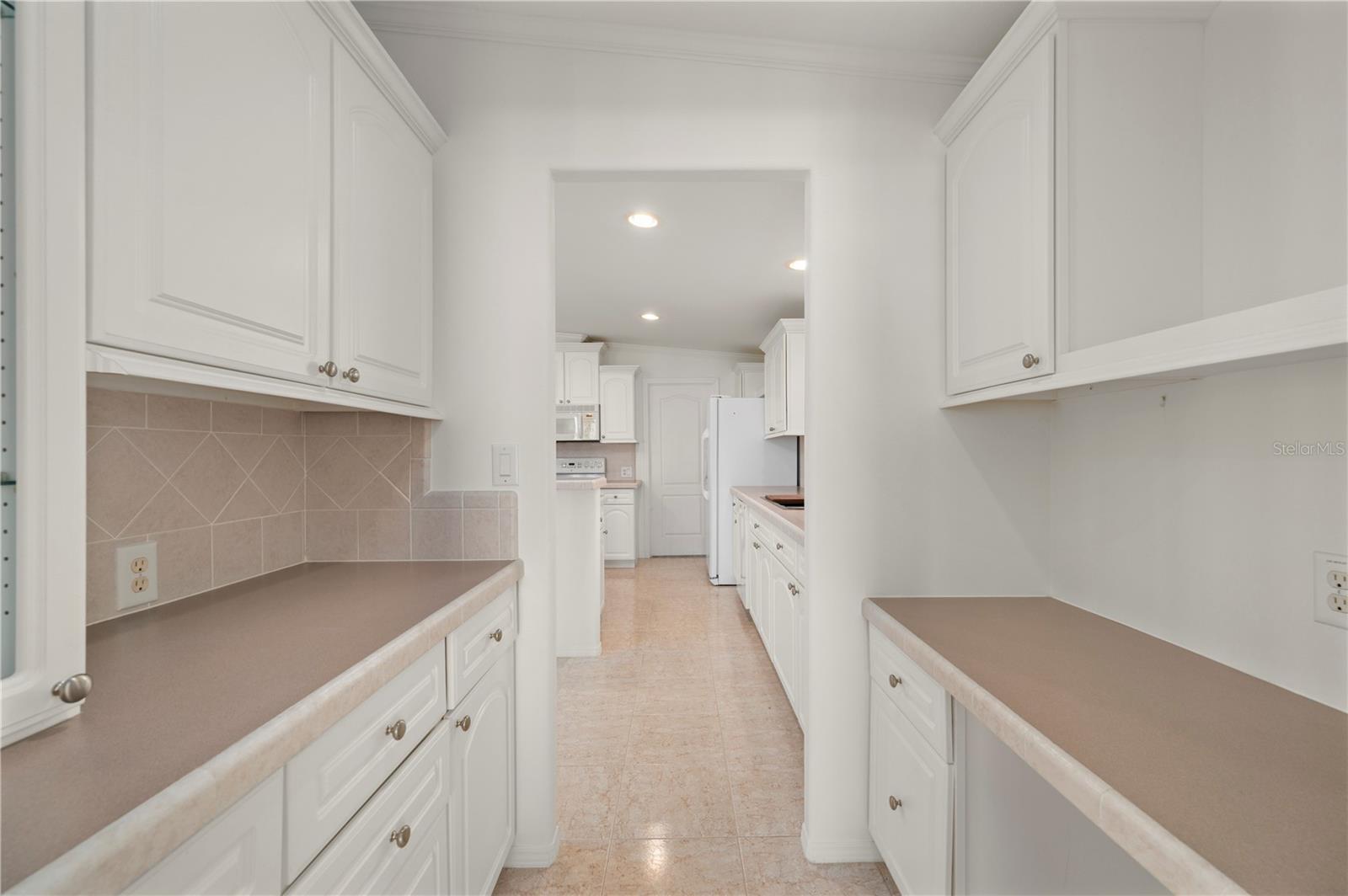 Butler Pantry view toward kitchen - 67 WINDMILL BLVD, PUNTA GORDA