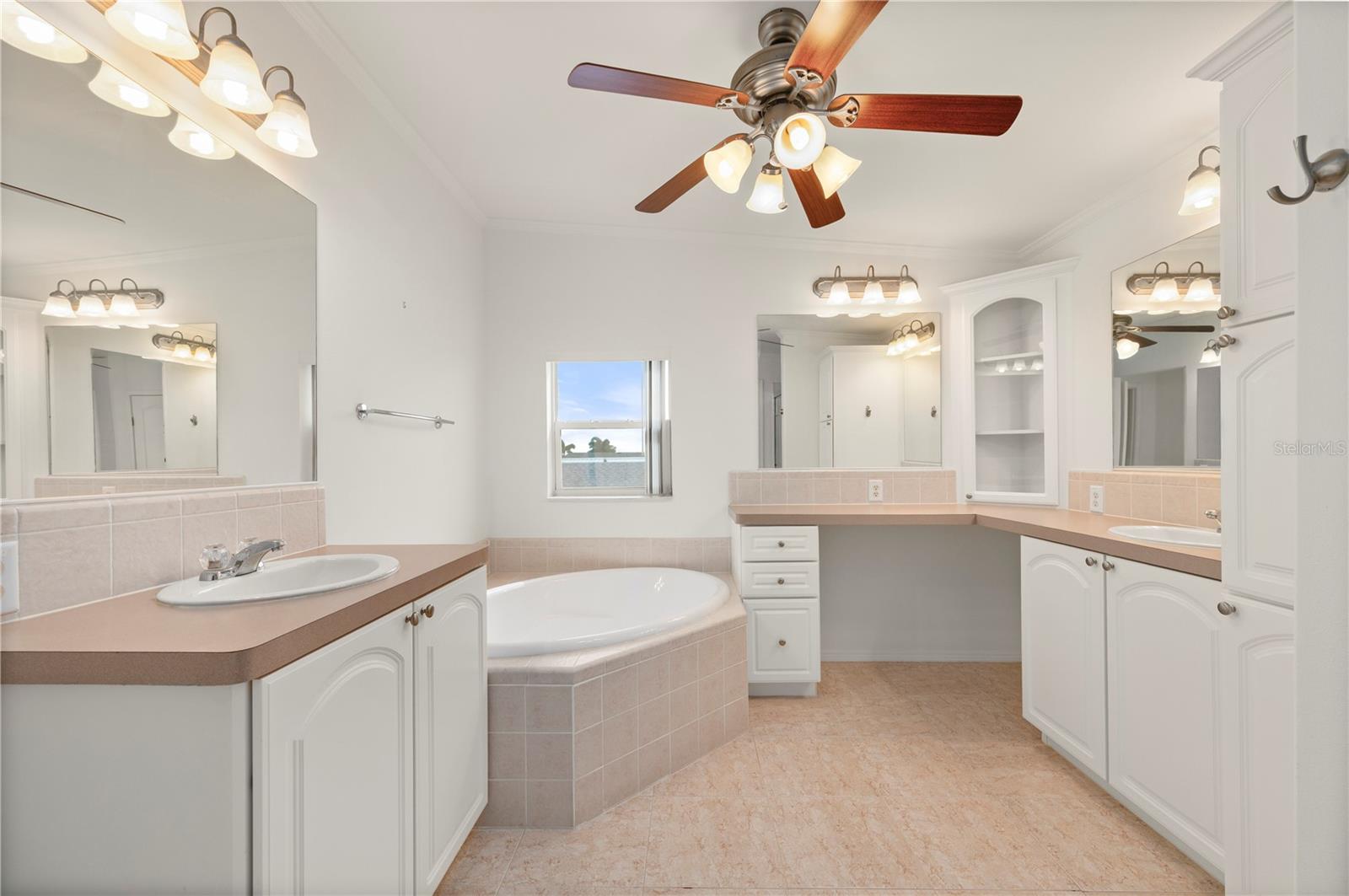 Main Bedroom's en suite bathroom dual sinks, makeup area, separate tub and shower, private w/c - 67 WINDMILL BLVD, PUNTA GORDA