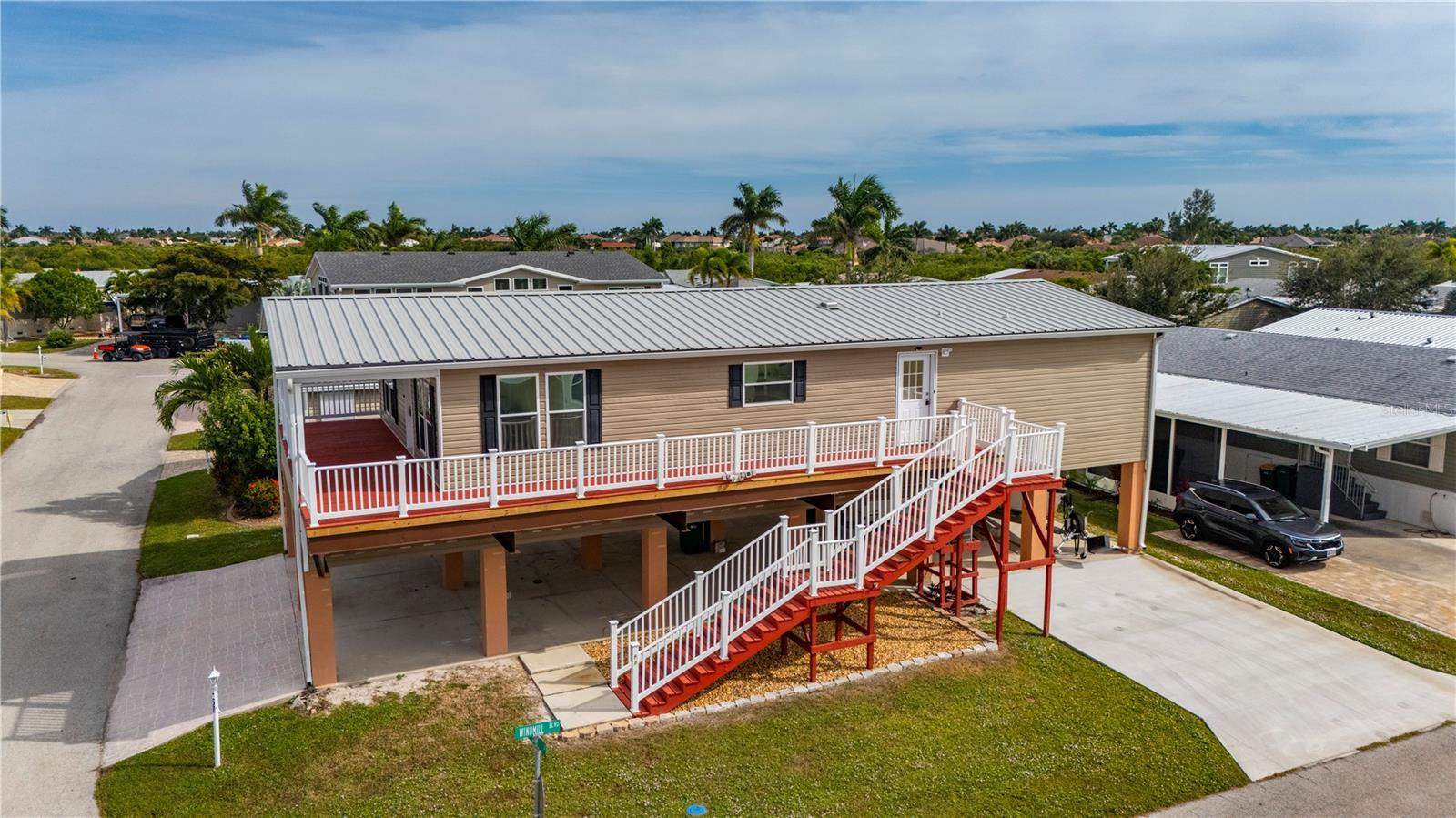 NEW Parking Pad for taller vehicles - 67 WINDMILL BLVD, PUNTA GORDA