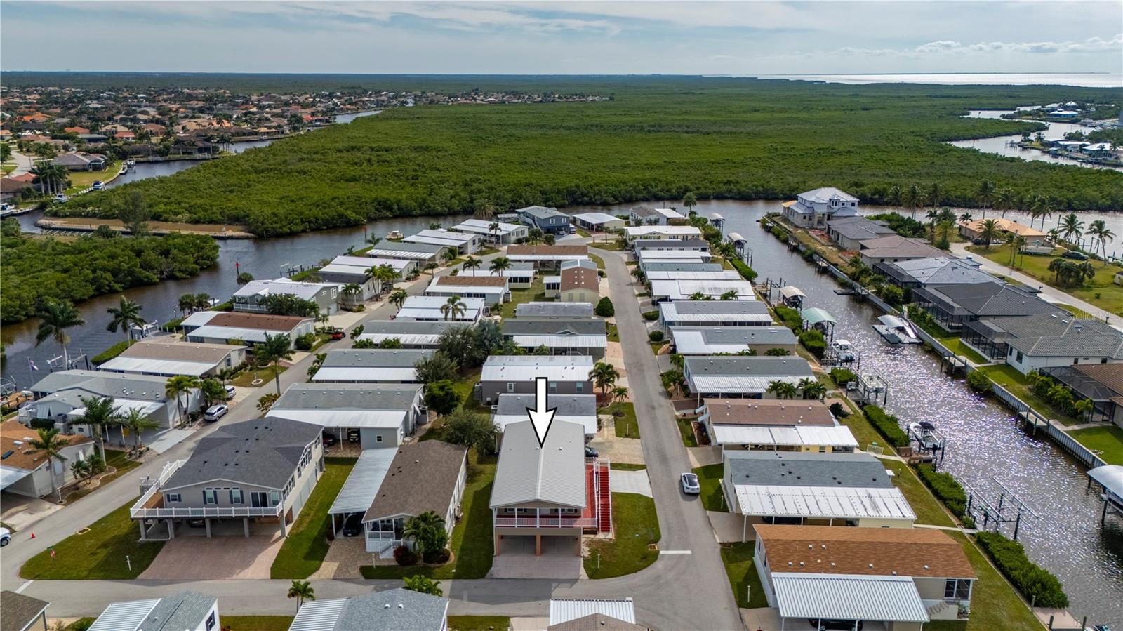 Aerial View looking South (Charlotte Harbor in to right of photo) - 67 WINDMILL BLVD, PUNTA GORDA