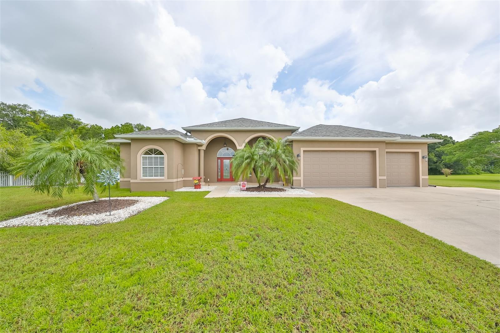 extra deep 3 car garage and large driveway - 17706 BRIDLEWOOD CT, PARRISH