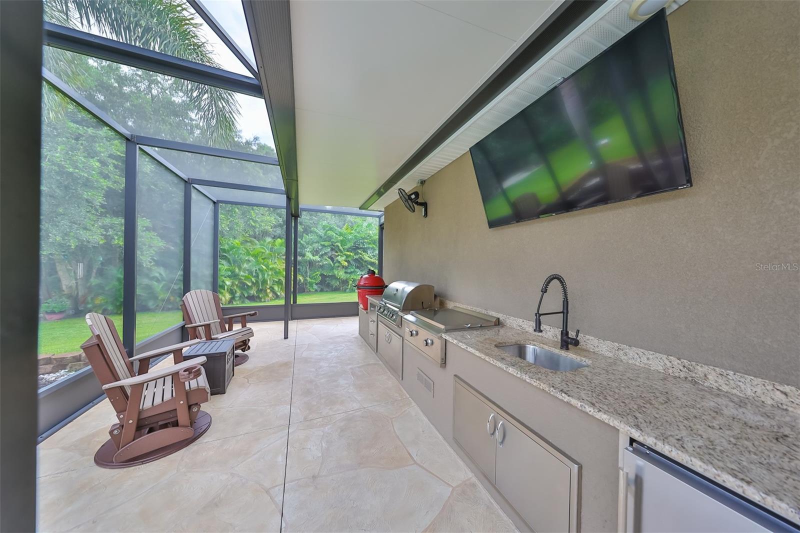 Outdoor area added in 2018-a Blaze grill & griddle, a Komodo Joe Red Egg grill & an outdoor refrigerator - 17706 BRIDLEWOOD CT, PARRISH