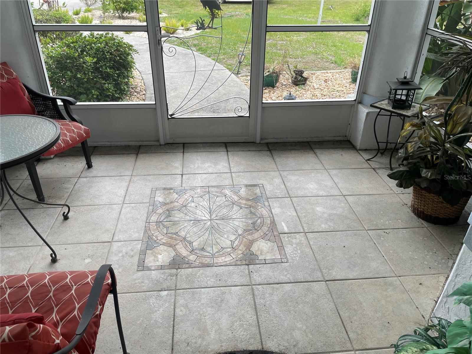 FOYER EBTRANCE SCREENED TILE INLAY - 18029 OHARA DR, PORT CHARLOTTE