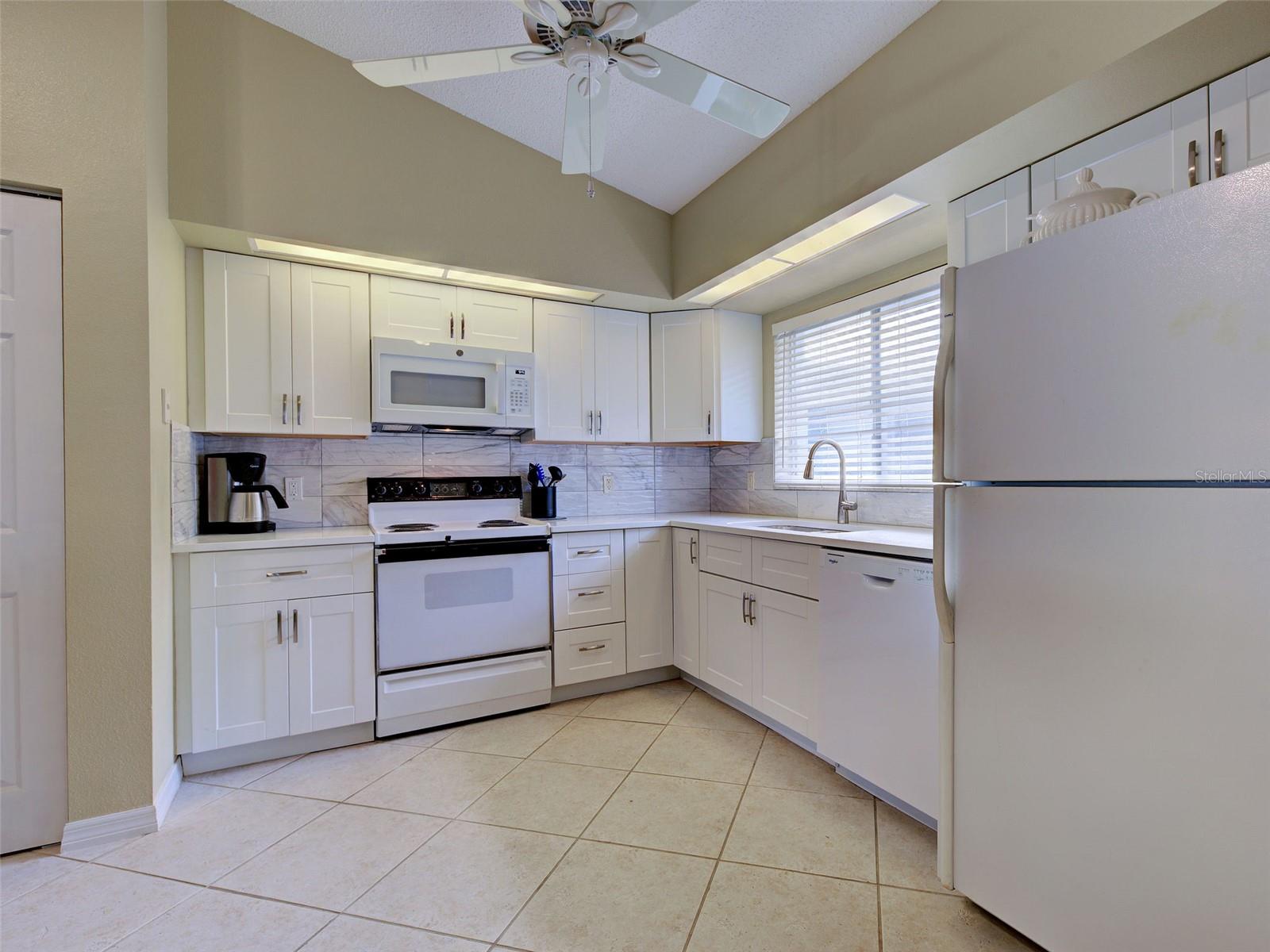 kitchen.... new dishwasher, microwave, soft close cabinets, backsplash - 6527 HAMLET DR #26B, ENGLEWOOD