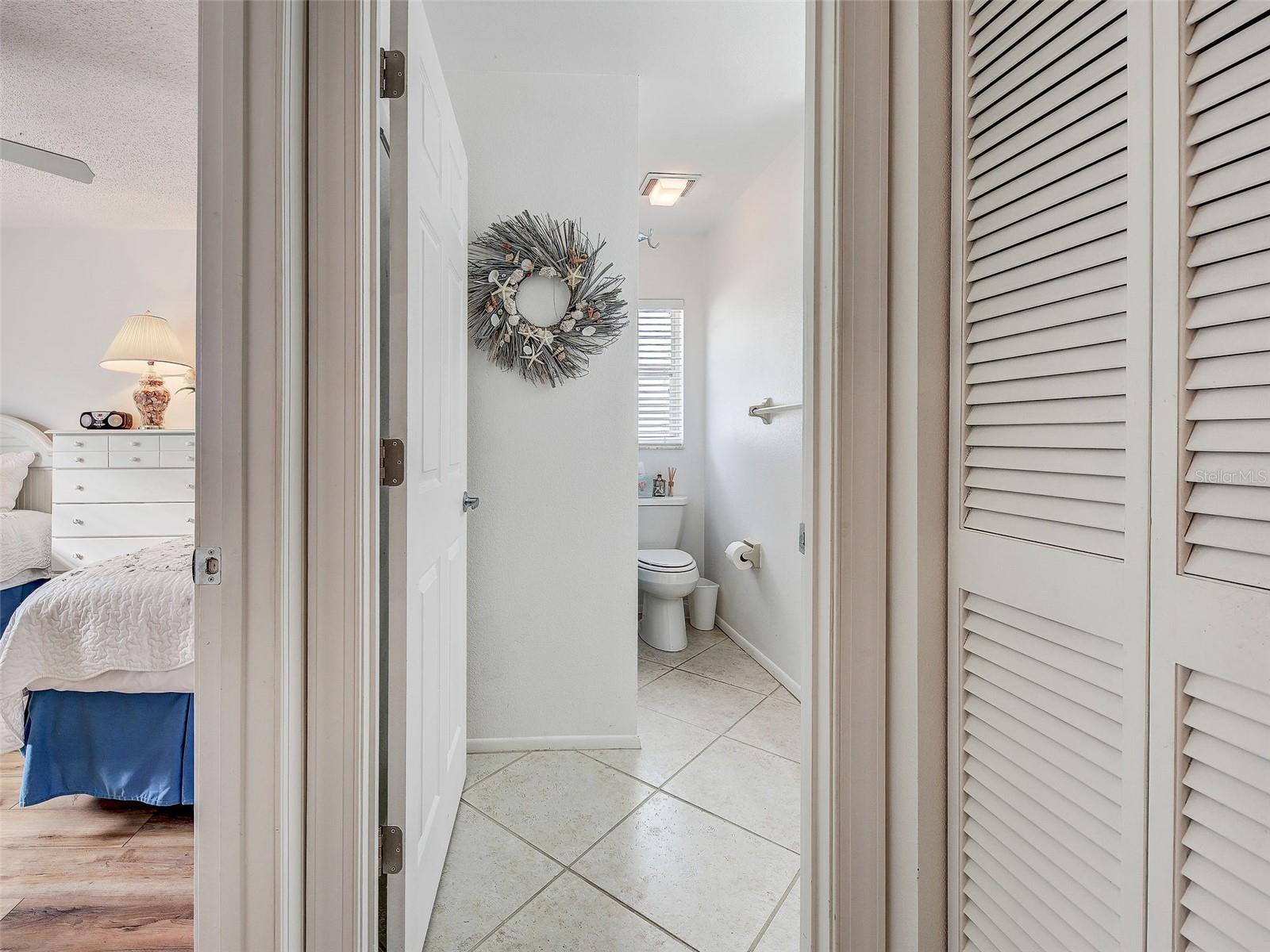 guest bath with shower/bathtub. Guest bedroom to the left - 6527 HAMLET DR #26B, ENGLEWOOD