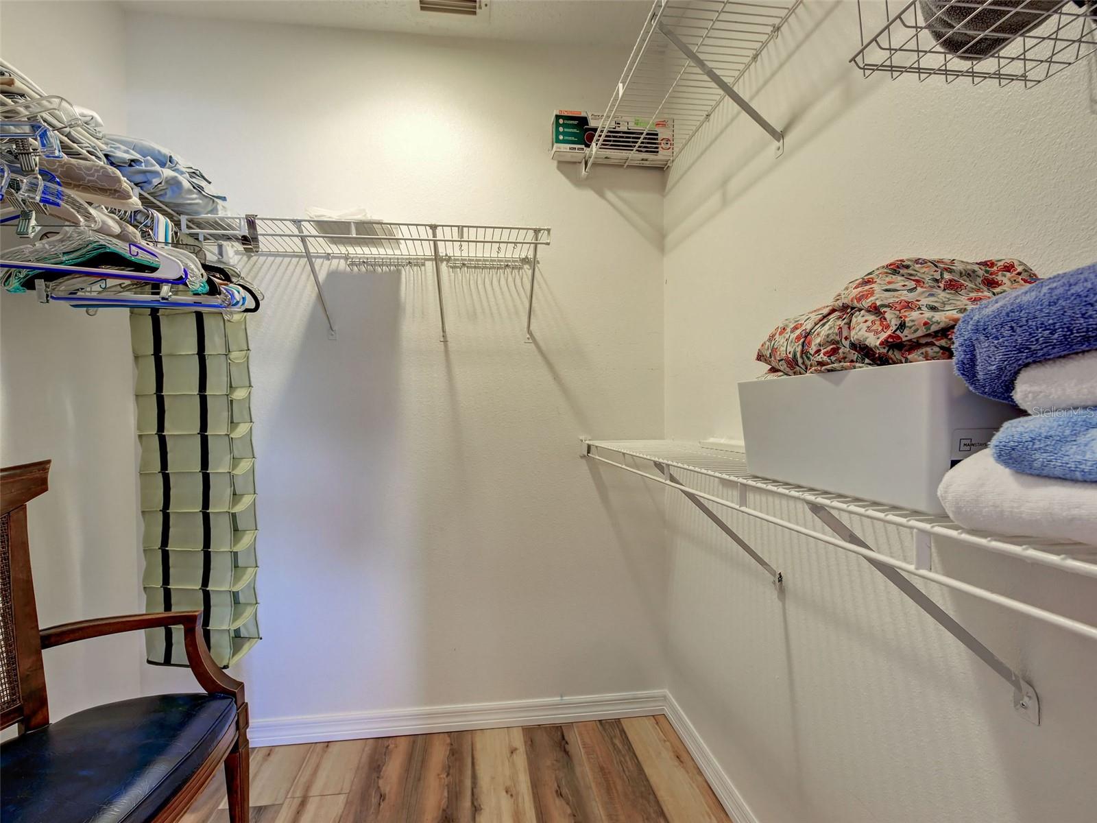 primary bedroom walk in closet, primary bedroom also has an ensuite bathroom - 6527 HAMLET DR #26B, ENGLEWOOD
