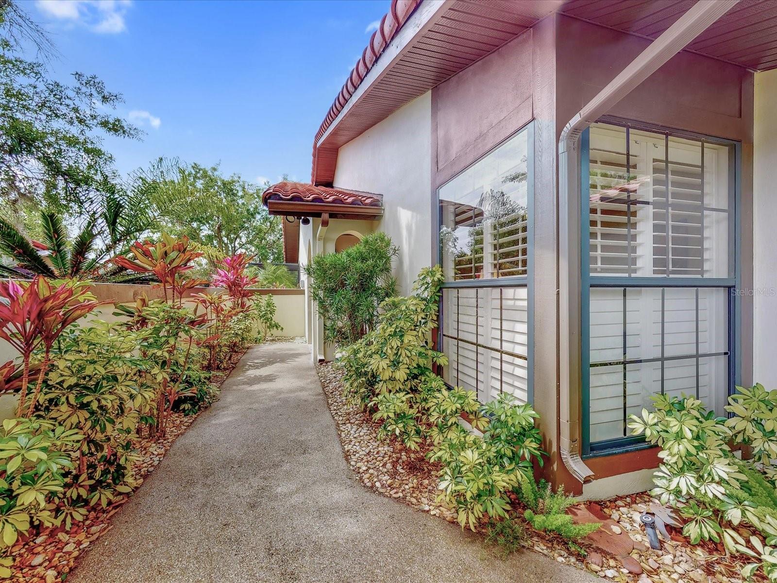 Up the path to the front door - 112 COVENTRY LN, HAINES CITY