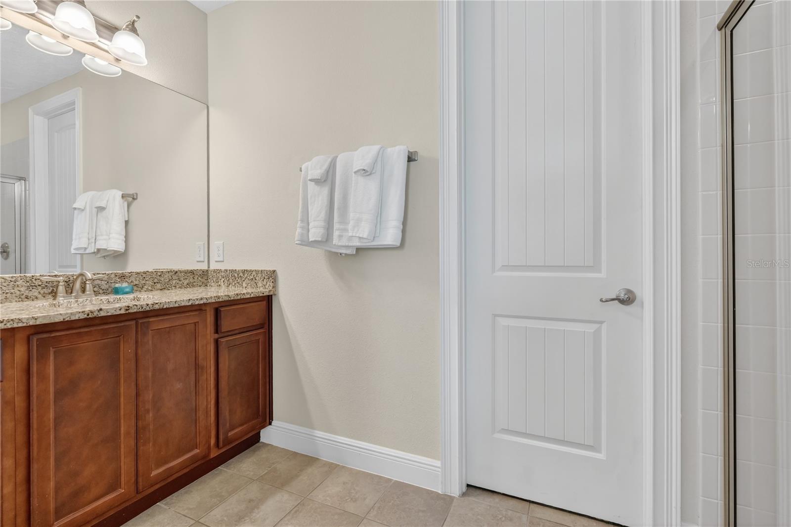 Ensuite to Bedroom 9 with Full Glass Enclosed Standing Shower - 7639 WILMINGTON LOOP, KISSIMMEE