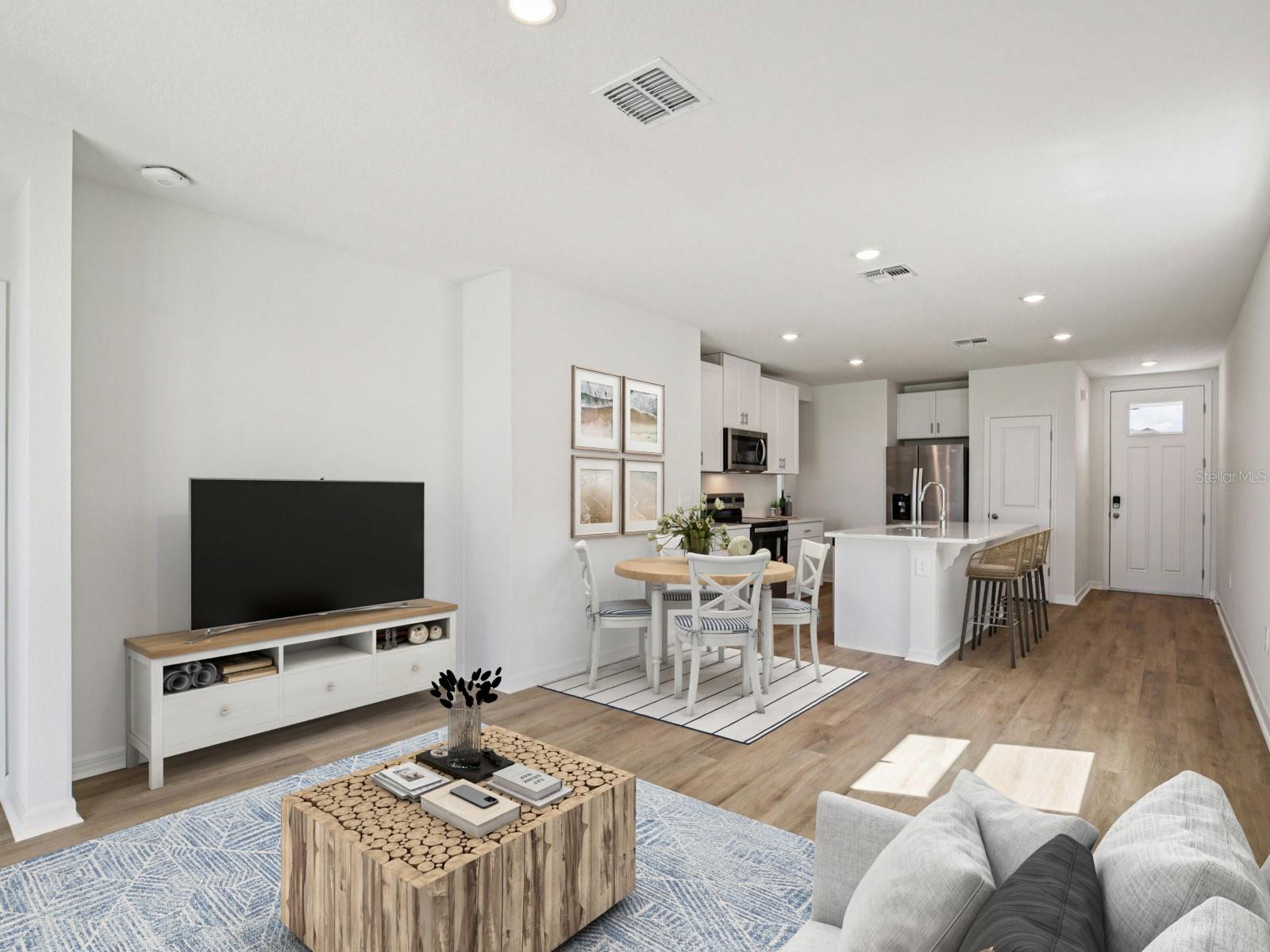 Interior photos are not of the actual home but are photos of the builder home with same floorplan with similar interior finishes and features. Photo uses virtual staging. - 11321 BELLEWOOD TER, PARRISH