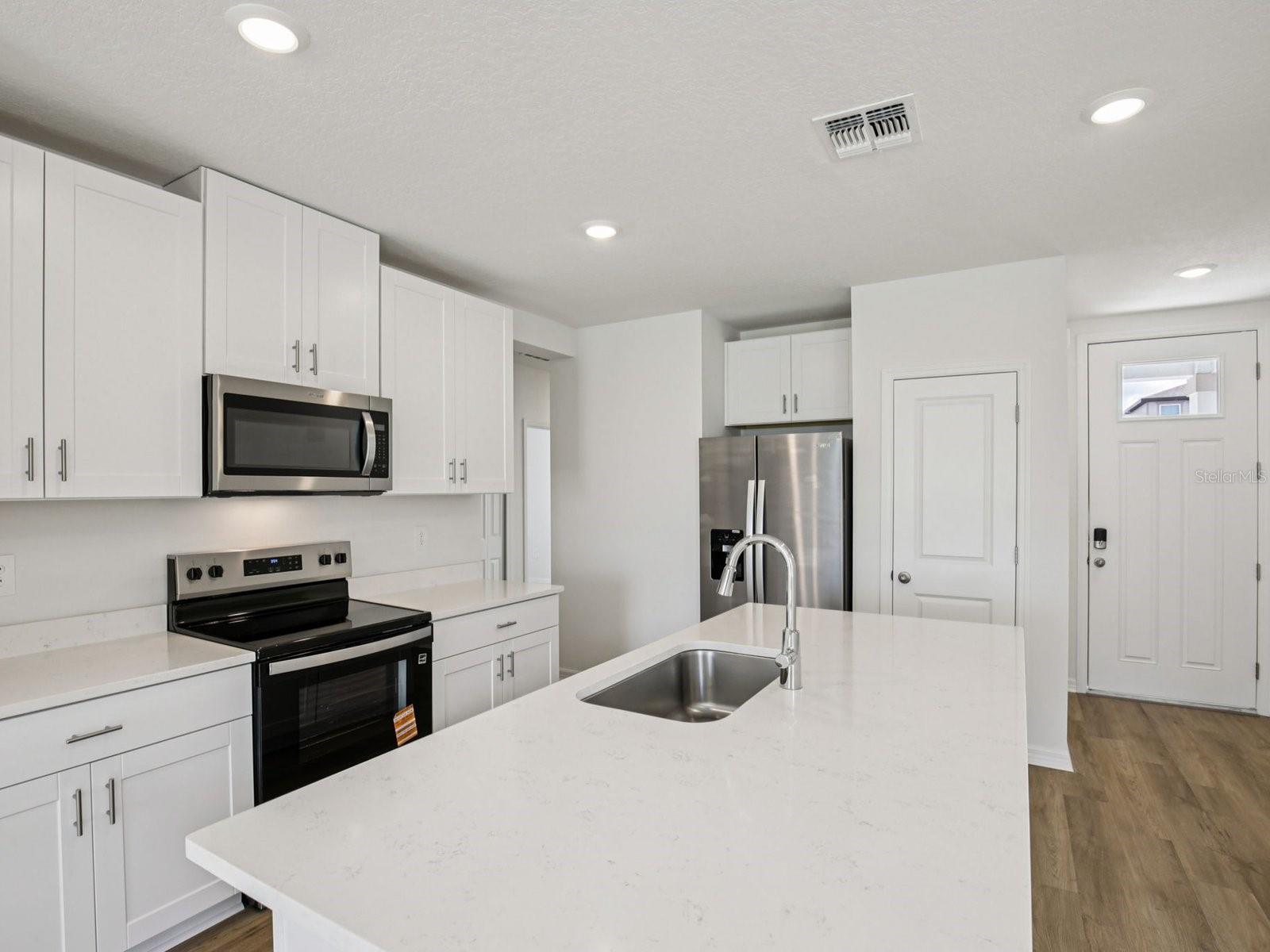 Interior photos are not of the actual home but are photos of the builder home with the same floorplan with similar interior finishes and features. - 11321 BELLEWOOD TER, PARRISH