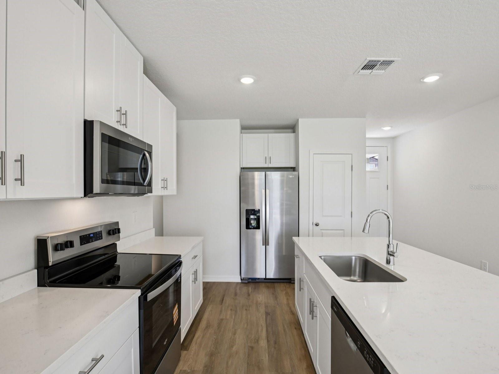 Interior photos are not of the actual home but are photos of the builder home with the same floorplan with similar interior finishes and features. - 11321 BELLEWOOD TER, PARRISH
