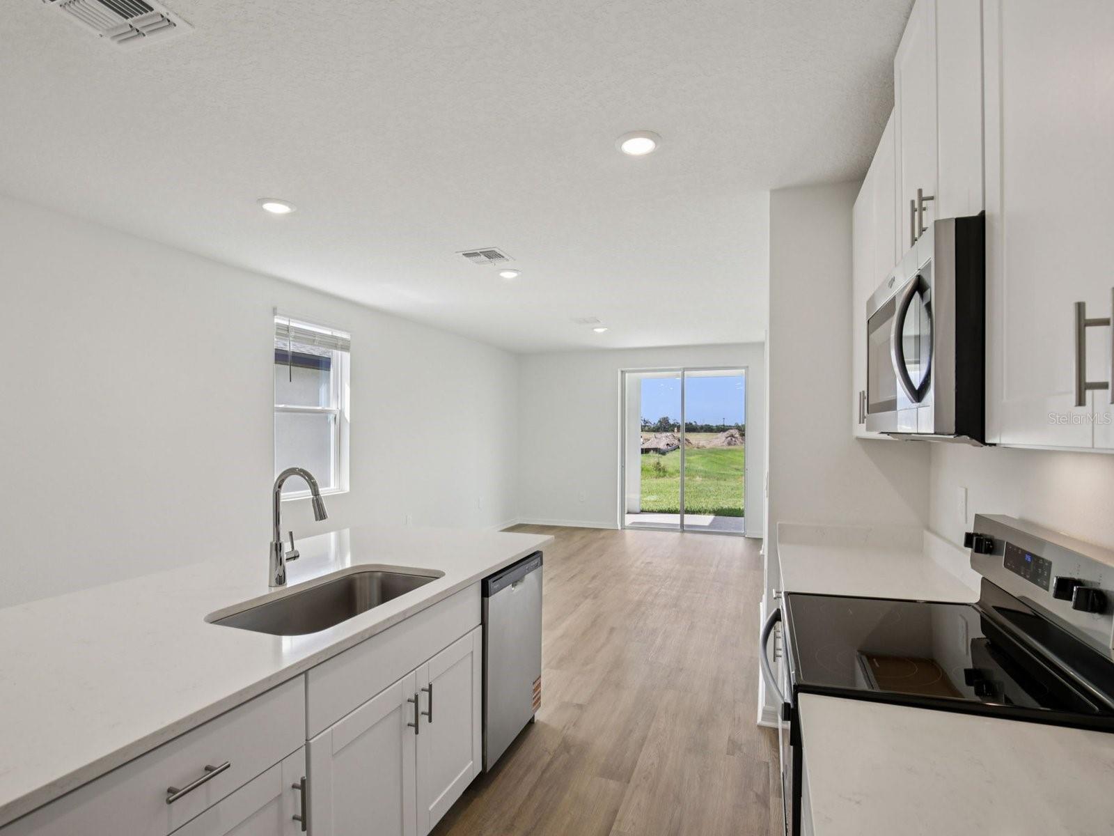 Interior photos are not of the actual home but are photos of the builder home with the same floorplan with similar interior finishes and features. - 11321 BELLEWOOD TER, PARRISH