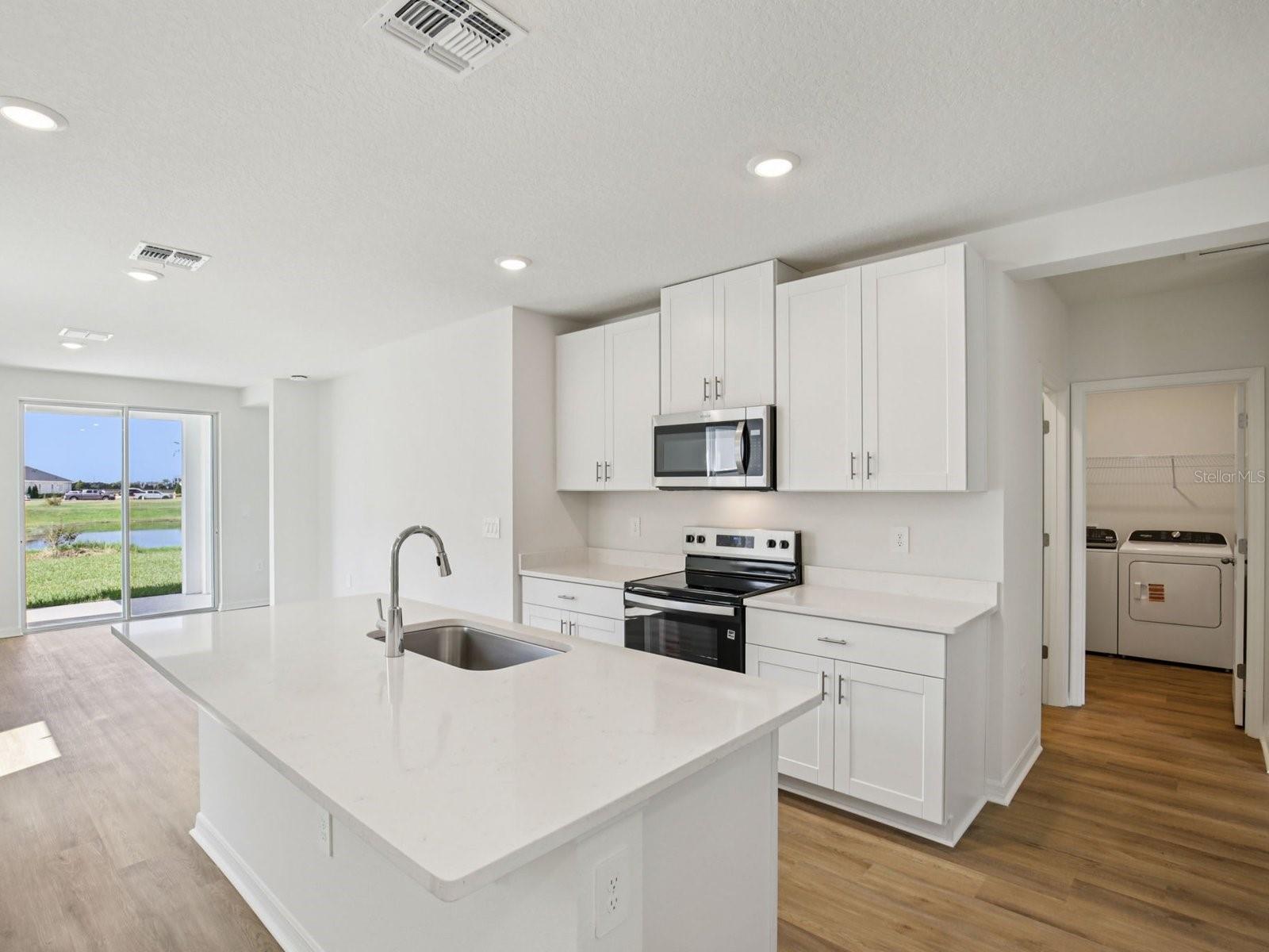 Interior photos are not of the actual home but are photos of the builder home with the same floorplan with similar interior finishes and features. - 11321 BELLEWOOD TER, PARRISH