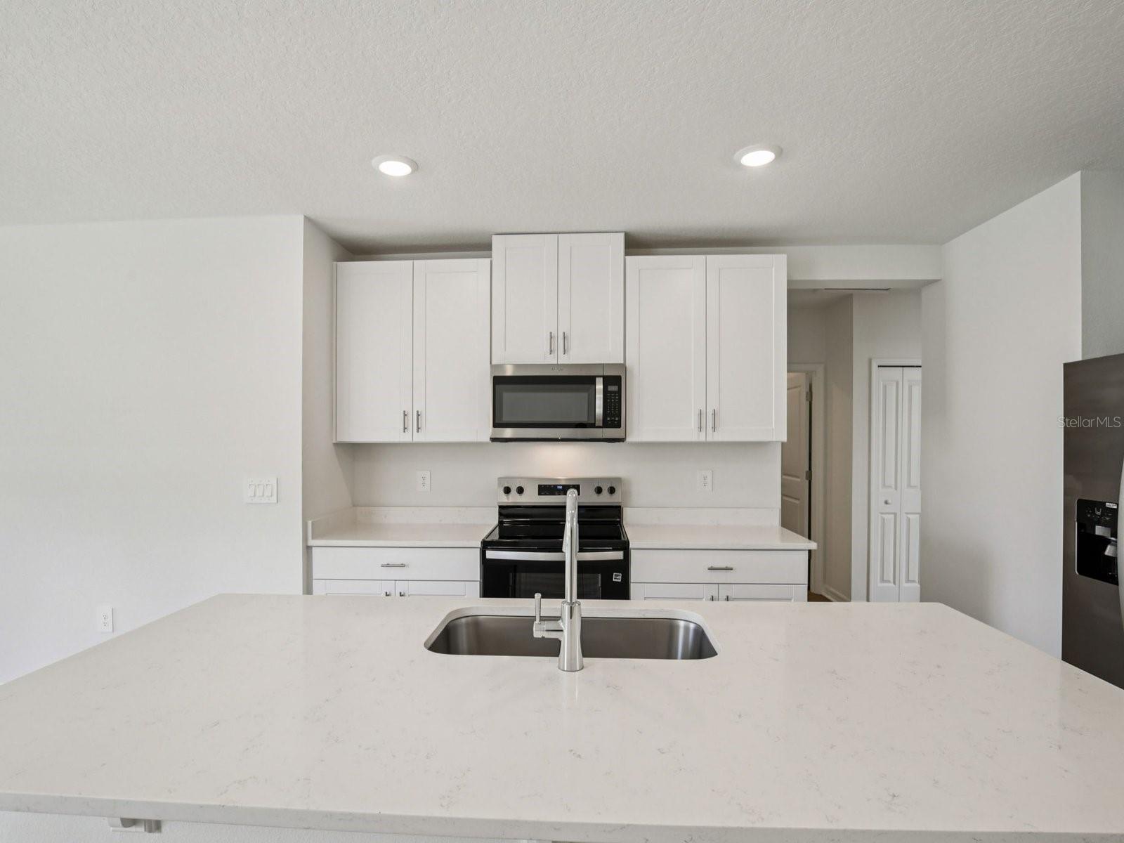 Interior photos are not of the actual home but are photos of the builder home with the same floorplan with similar interior finishes and features. - 11321 BELLEWOOD TER, PARRISH