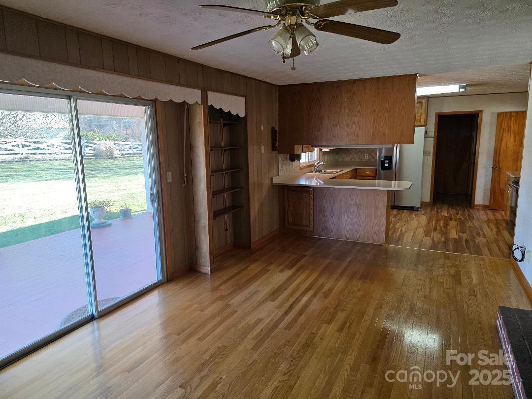 Den with sliding glass doors to the patio - 1375 E US Highway 19E Highway, Burnsville