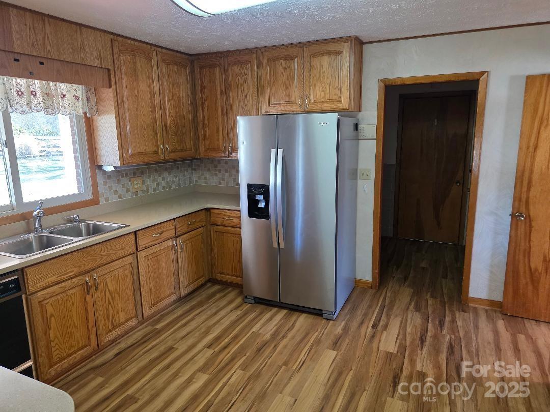 Kitchen with recently purchased refrigerator - 1375 E US Highway 19E Highway, Burnsville