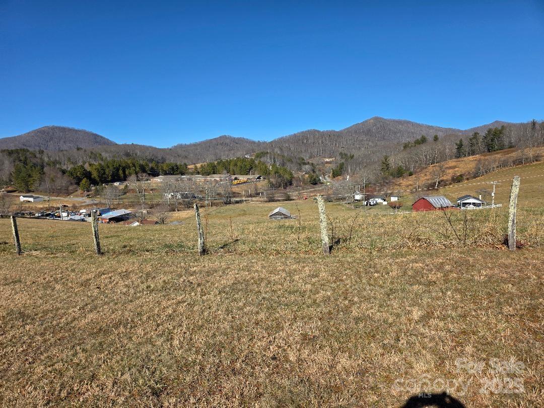 View looking north with Burnsville Elementary School in the foreground and King's Mountain/Sol Fox Knob in the background - 1375 E US Highway 19E Highway, Burnsville