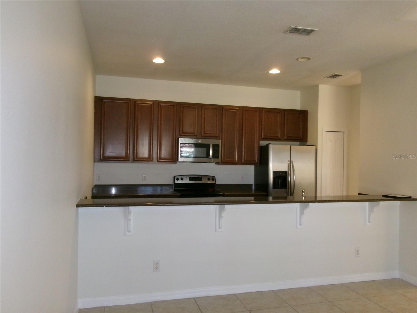 Kitchen view - 8969 MAJESTY PALM RD, KISSIMMEE