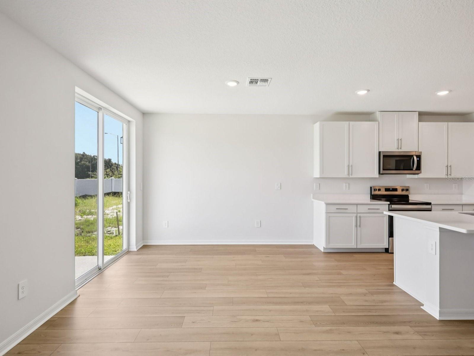 Interior photos are not of the actual home but are photos of the builder home with same floorplan with similar interior finishes and features. - 10425 ABUNDANCE GROVE WAY, PARRISH
