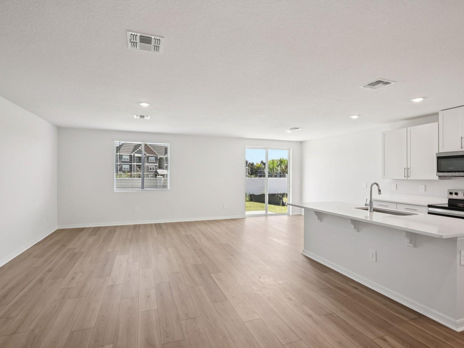 Interior photos are not of the actual home but are photos of the builder home with same floorplan with similar interior finishes and features. - 10425 ABUNDANCE GROVE WAY, PARRISH