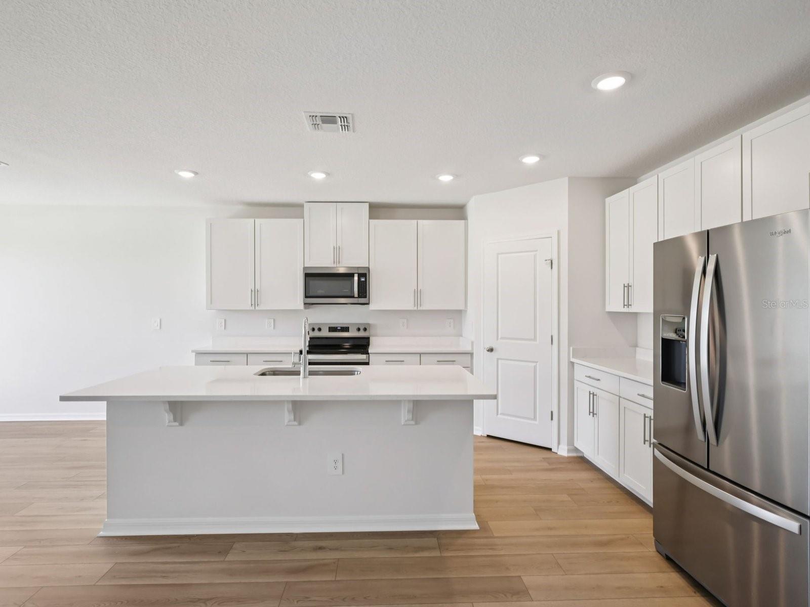 Interior photos are not of the actual home but are photos of the builder home with same floorplan with similar interior finishes and features. - 10425 ABUNDANCE GROVE WAY, PARRISH