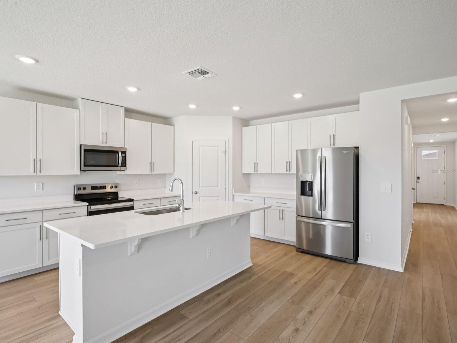 Interior photos are not of the actual home but are photos of the builder home with same floorplan with similar interior finishes and features. - 10425 ABUNDANCE GROVE WAY, PARRISH