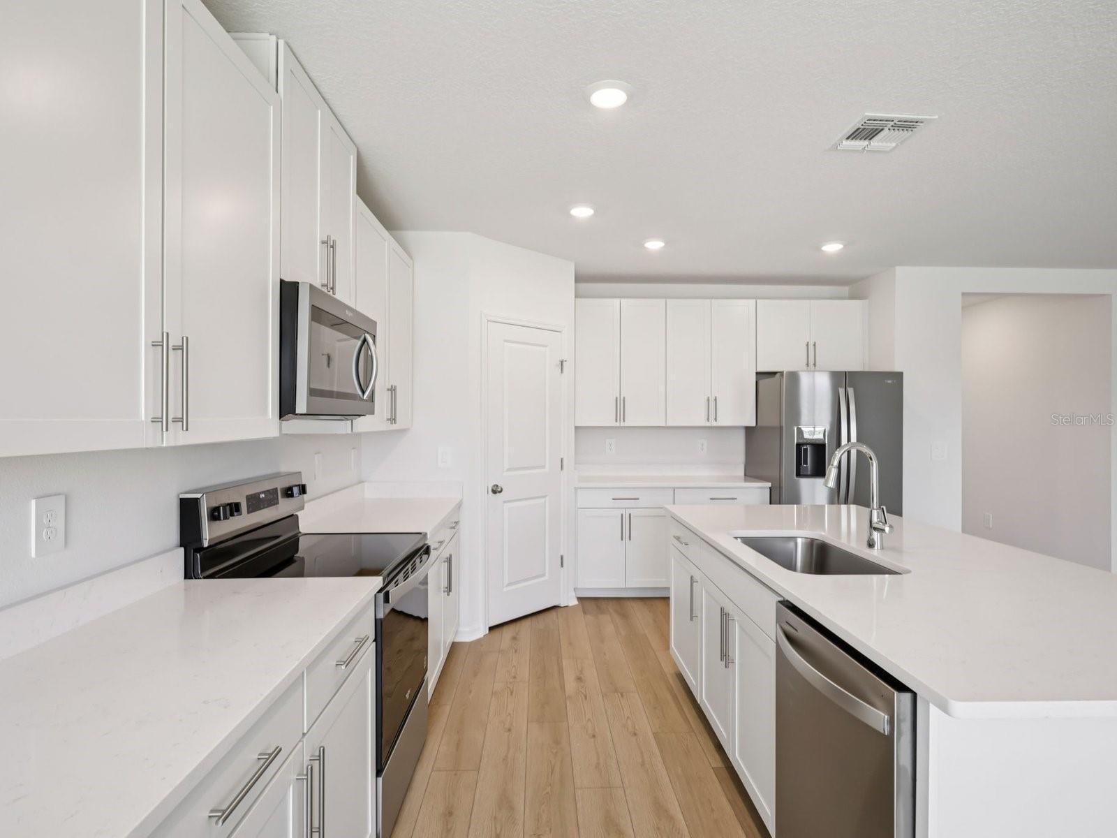 Interior photos are not of the actual home but are photos of the builder home with same floorplan with similar interior finishes and features. - 10425 ABUNDANCE GROVE WAY, PARRISH