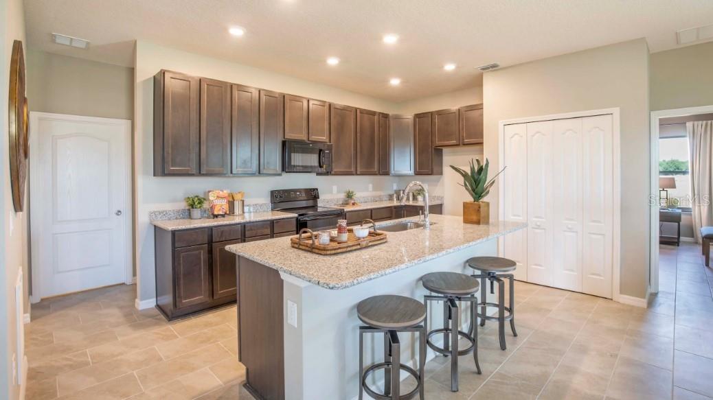 Model home - actual features may vary. - 74 ENCLAVE AVE, PALM COAST