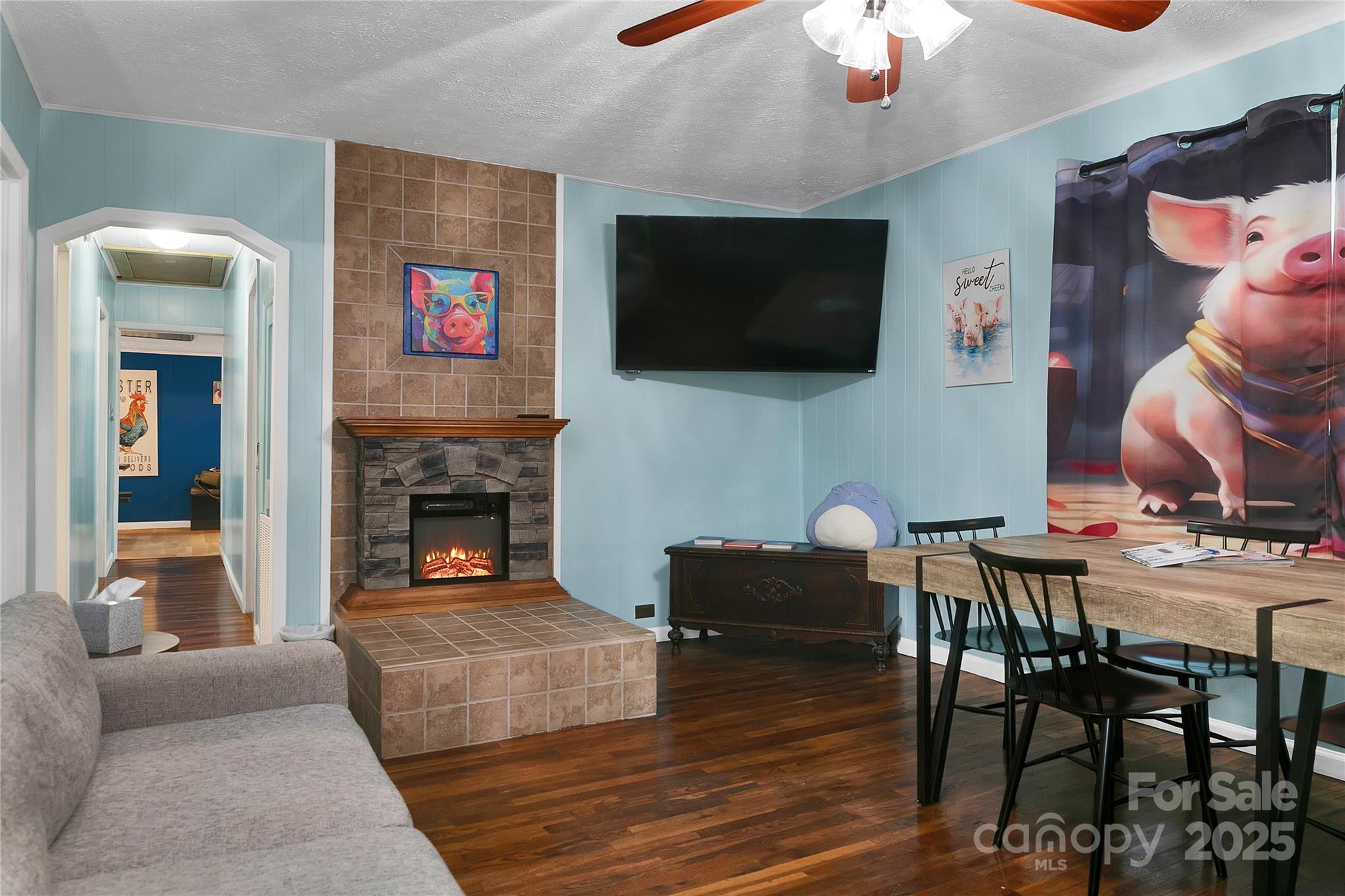 Living Room, decorated with piggies, seen here as you enter the front door from the front porch. - 626 Fairview Loop, Hot Springs