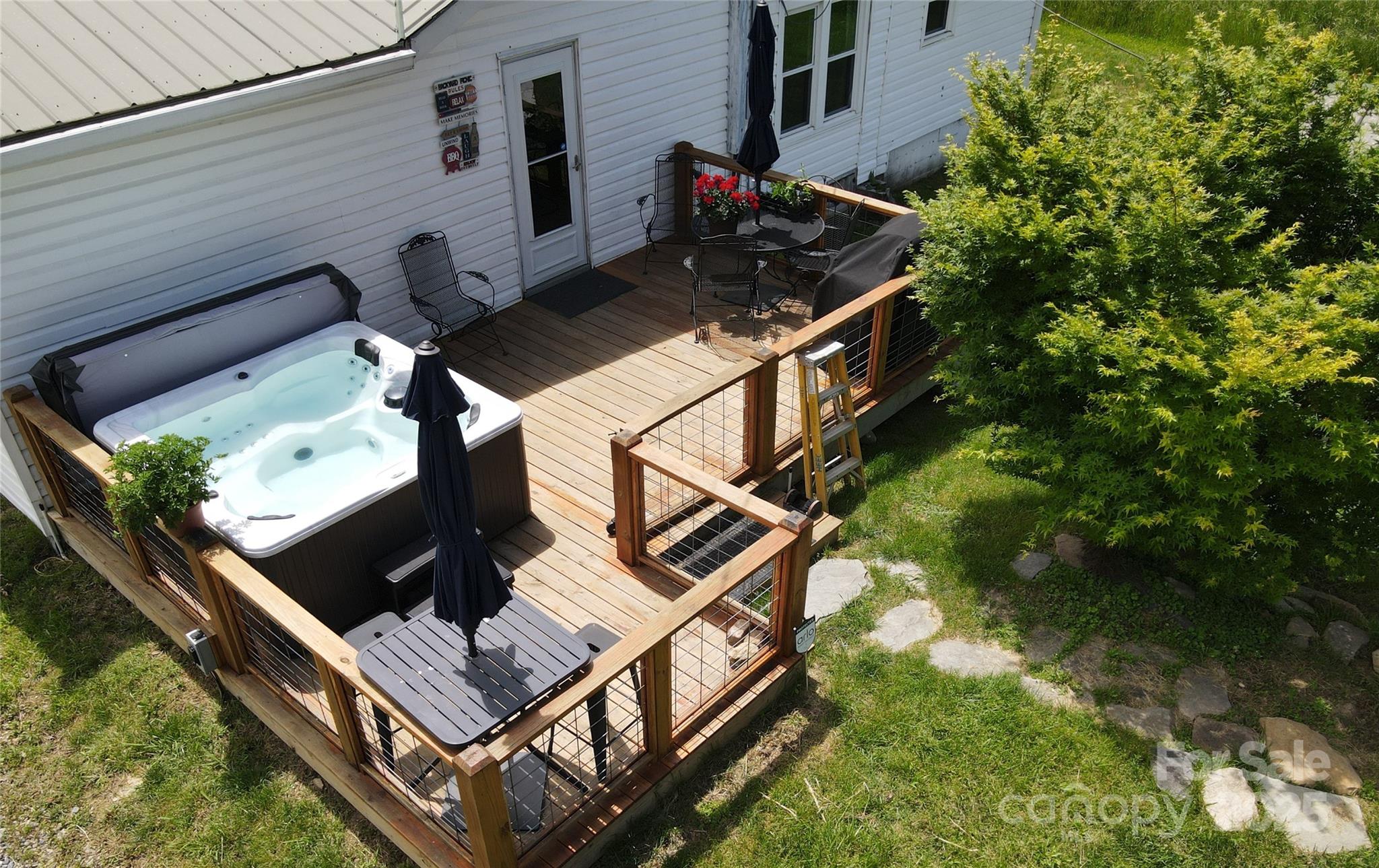 Rear Deck with the grill and table on its right side. - 626 Fairview Loop, Hot Springs