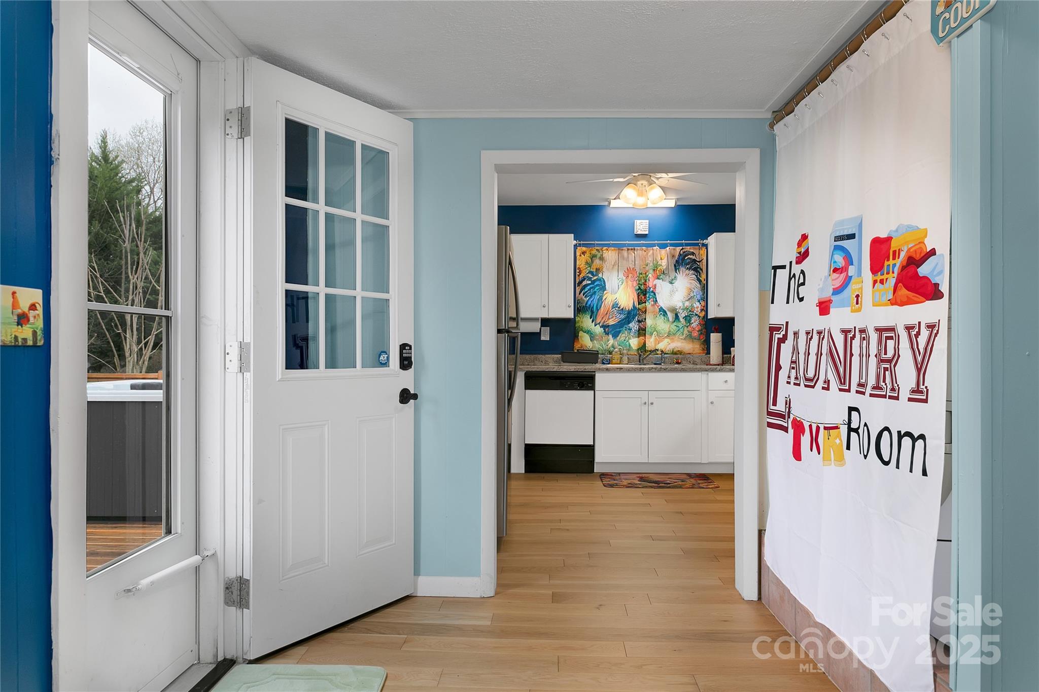 The rear deck door brings you into the dining room on the right, kitchen on the left. - 626 Fairview Loop, Hot Springs
