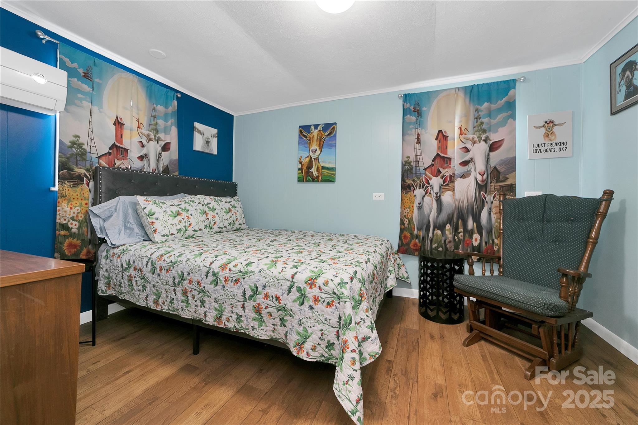The rear bedroom suite has its own thermostat and air-conditioning unit to allow a differential in temperature from the rest of the house if desired. The middle bedroom is alive with bunny rabbits in every corner! Light and bright with beautiful oak hardwood floors. - 626 Fairview Loop, Hot Springs