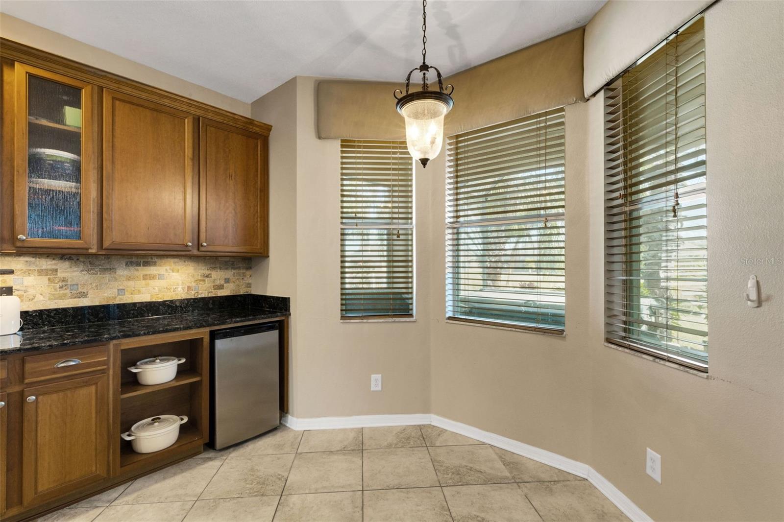 Mini-Fridge conveys with home, a breakfast table fits nicely in the bay window area. - 5220 119TH TER E, PARRISH