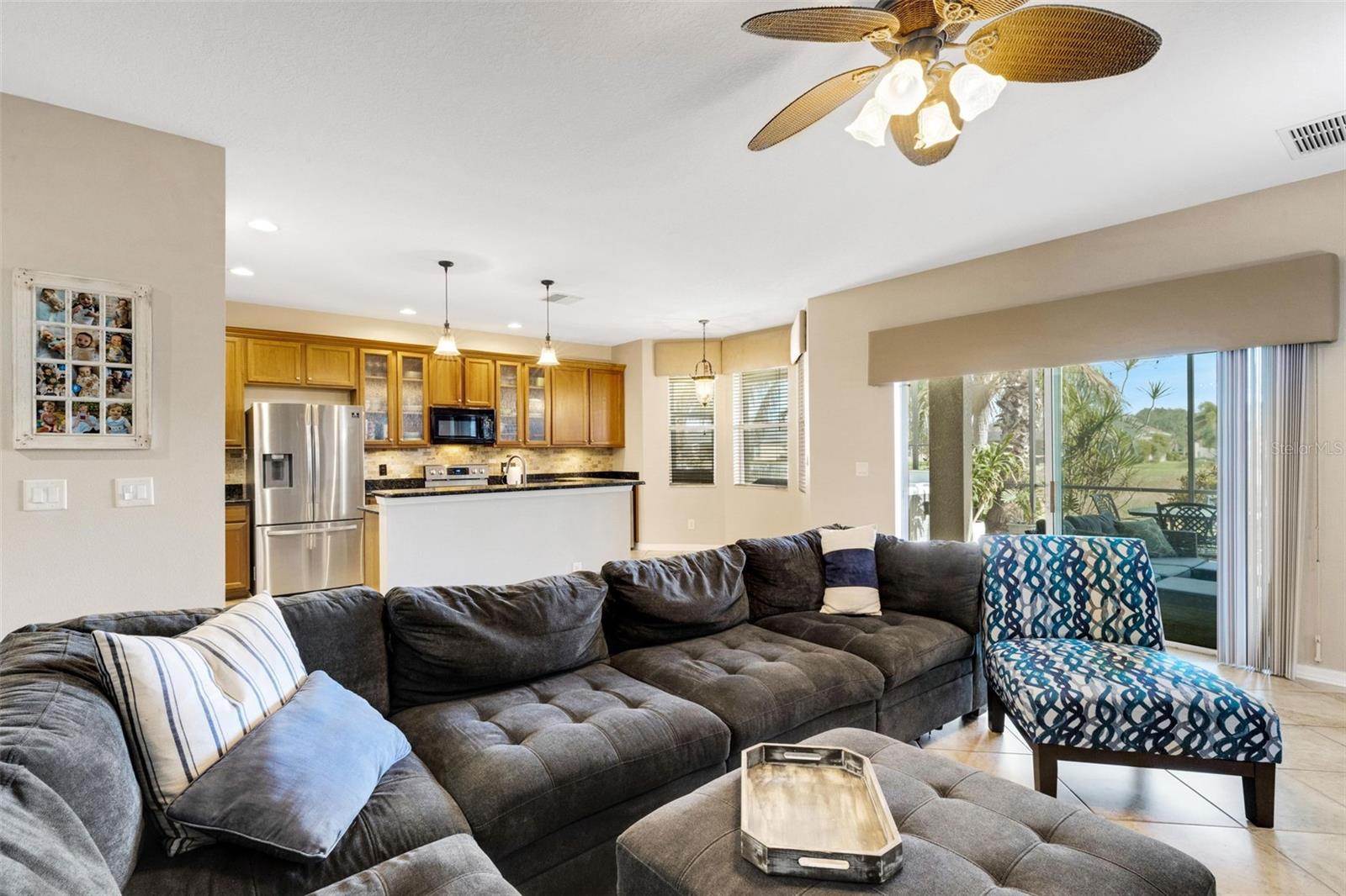 Open-concept main living area with seamless flow to the kitchen and lanai - 5220 119TH TER E, PARRISH