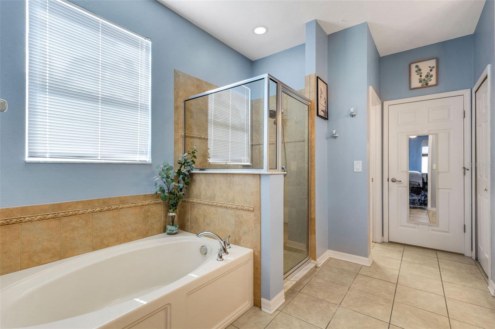 Primary bathroom includes a soaking tub and separate walk-in shower. - 5220 119TH TER E, PARRISH